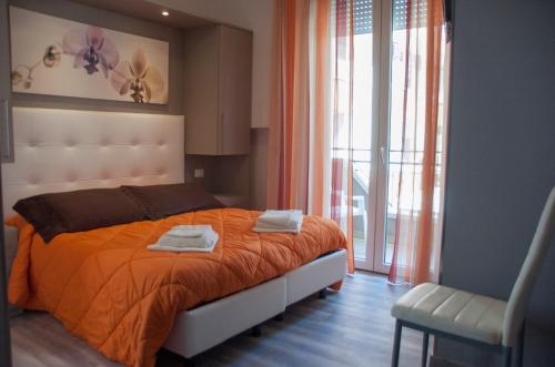 Postel nebo postele na pokoji v ubytování Albergo Villa Miraggio