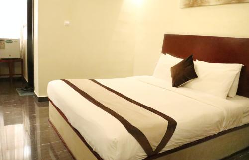 Katil atau katil-katil dalam bilik di Rimal Suites Apartments