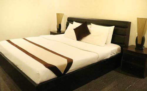 Katil atau katil-katil dalam bilik di Rimal Suites Apartments