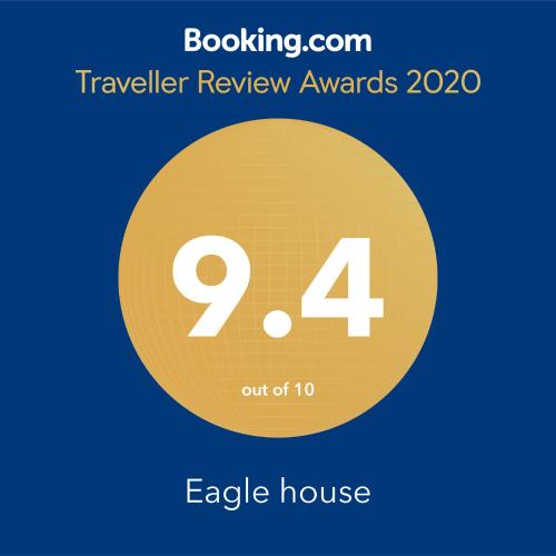a yellow circle with the number four inside at Eagle house in Përmet
