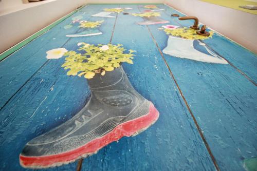 a cake with a shoe on top of a table at A Carubba du Bungiurnu in Borgio Verezzi