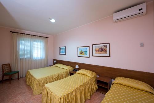 Кровать или кровати в номере Valle Degli Ulivi