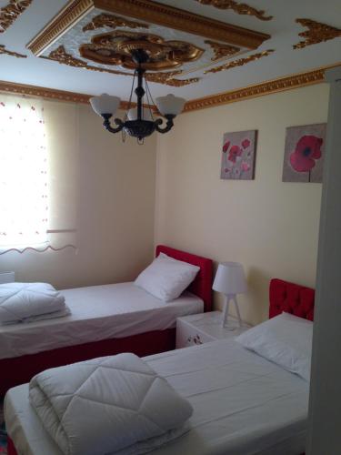 a bedroom with two beds and a ceiling at seasidehouse in Ordu