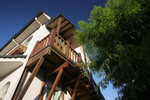 a balcony on the side of a building at Sheep House B&B in Jian
