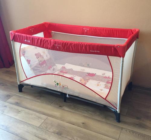 a red and white bunk bed in a room at Apartmán Bešeňová in Bešeňová