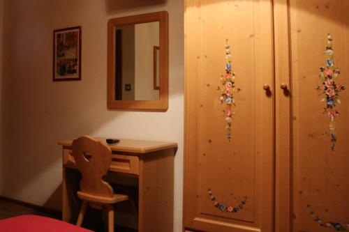 a room with a wooden floor and wooden walls at Hotel Galeno in Auronzo di Cadore