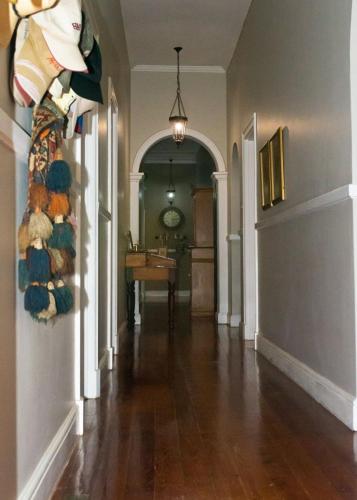 a hallway of a home with a wooden floor at Anna's Farm Stay in Slangrivier