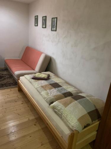 a couch and a bed in a room at Miroslav Bednár-Bedomir in Huta