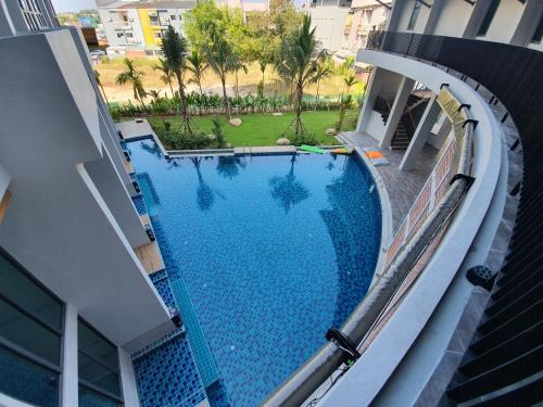 an overhead view of a swimming pool in a building at Atom Phuket Hotel in Nai Yang Beach