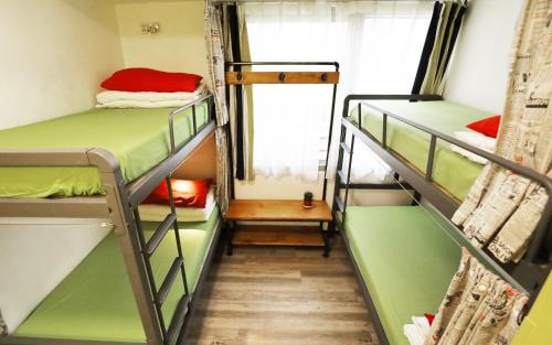 A bunk bed or bunk beds in a room at Yesinn @YMT