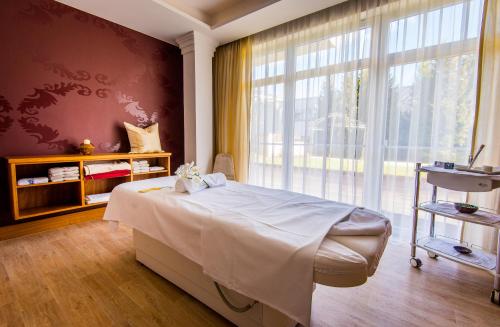 Grandhotel Lienz Business-Wellness & Gourmetにあるベッド