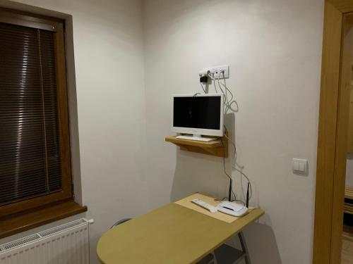 a room with a desk with a computer monitor on it at Miroslav Bednár-Bedomir in Huta
