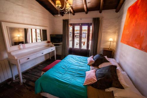 Una cama o camas en una habitación de Pueblo Indio