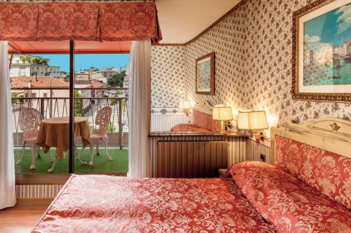 Postelja oz. postelje v sobi nastanitve Hotel Venezia