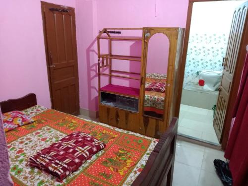 Giường trong phòng chung tại Green Home Stay Kolkata