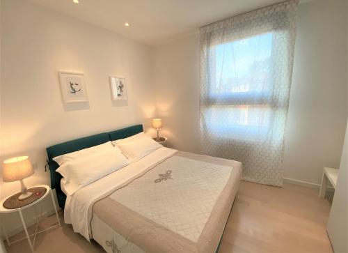 a small bedroom with a bed and a window at BED in BO Saragozza in Bologna