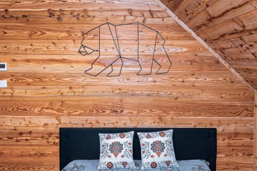 a wall with a drawing of a bear on it at Bury Miś in Jaworki