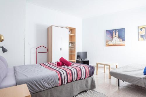 Posteľ alebo postele v izbe v ubytovaní Apartamentos Tarradellas Sants Estació