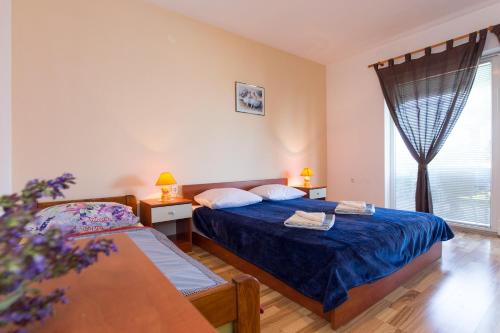 Ένα ή περισσότερα κρεβάτια σε δωμάτιο στο Holiday Home Larma