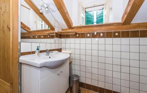 a bathroom with a sink and a window at Ranch Frida in Vodice