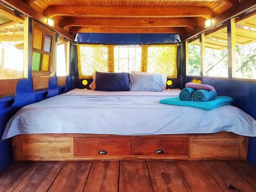 a large bed in the back of a bus at CALA Guane Barichara in Guarne