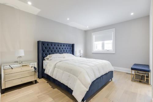 a bedroom with a large bed and a window at Luxury Adventure, Rutherford Go station & Wonderland in Vaughan