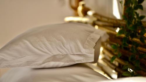 a close up of a pillow on a bed at Pensiunea Dealul Verde in Porumbacu de Sus