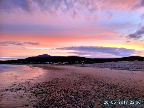 a view of a beach at sunset at Creevagh (Room Only) in Keel