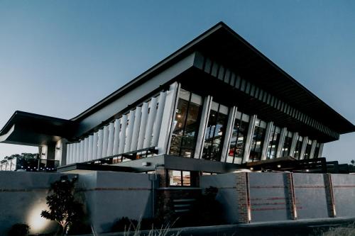a building with a lot of windows on it at Highlander Hotel Bar Kitchen Rooftop in Adelaide