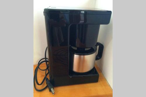 a coffee maker sitting on top of a counter at Woody house in Nakano
