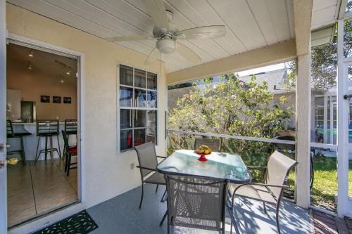 a screened in porch with a table and chairs at Mickey's Lake Villa 2 in Orlando