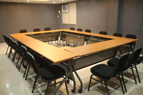 a conference room with a long table and chairs at 1A Express Hotel in Cagayan de Oro