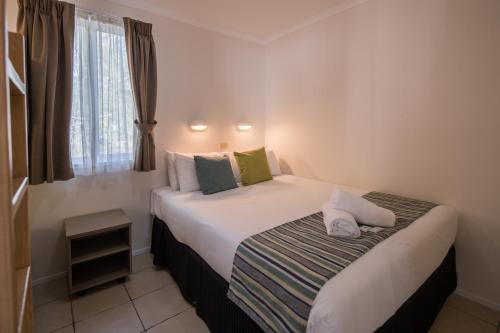 a hotel room with two beds with a window at Ingenia Holidays Lake Macquarie in Mannering Park