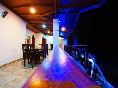 a long table in a room with a dining room at Home Living Unit in Galle