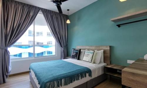 a bedroom with a bed and a large window at The Wave Residence Melaka in Melaka