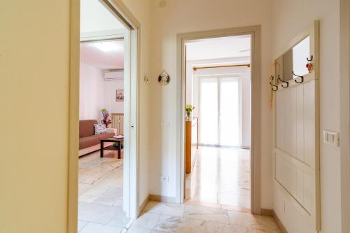 a hallway with a door leading to a living room at Da Cipollina in Pieno Centro in Sanremo