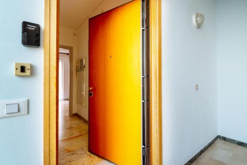 a yellow and red door in a room at Da Cipollina in Pieno Centro in Sanremo