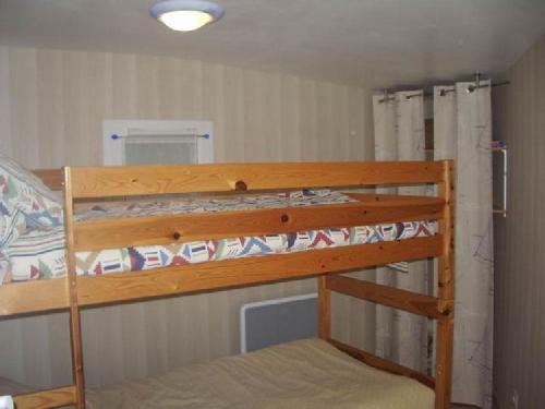 Μία ή περισσότερες κουκέτες σε δωμάτιο στο villa OLERON