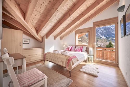 Ένα ή περισσότερα κρεβάτια σε δωμάτιο στο Chalet Bergfrieden Penthouse
