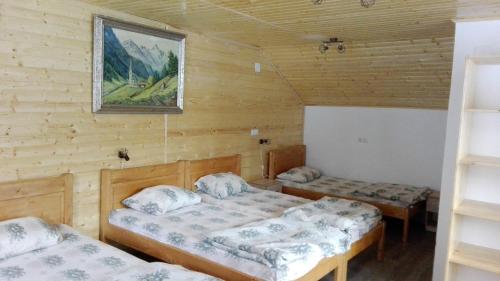 Кровать или кровати в номере Complex turistic Nora Rau Sadului