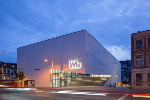 a building with a sign on the side of it at Luxury Panoramic Vilnius apartment in Vilnius