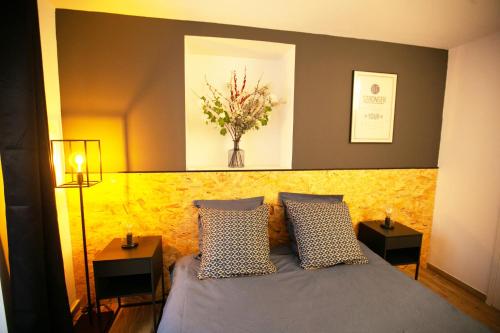Cama ou camas em um quarto em 2 pièces avec patio dans le centre de Toulon