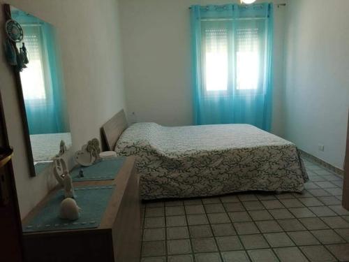 Giường trong phòng chung tại villaparadiso seccagrande 2