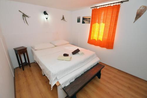 Postel nebo postele na pokoji v ubytování Kornati Robinzon House