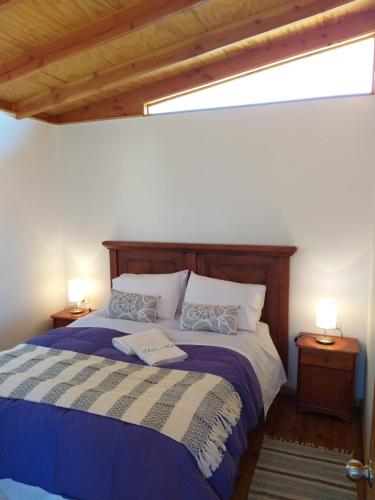 a bedroom with a bed with a book on it at Casa Vesta Mar in San Antonio