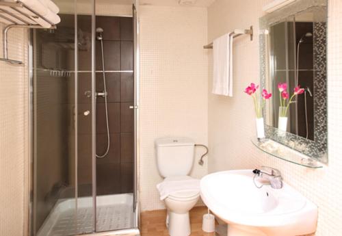 a bathroom with a shower and a toilet and a sink at My Address in Barcelona Downtown in Barcelona