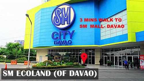 a shopping center with a sign on the side of it at ONE OASIS DAVAO a4 FREE POOL 3 MIN WALK SM MALL in Davao City