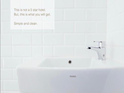 a bathroom with a sink and a sign that says this is not a star hotel at The Grand Uddhav in New Delhi