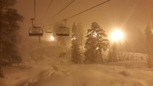 a ski lift in a snow storm with a light at Kongsberg Hostel-Vandrerhjem in Kongsberg