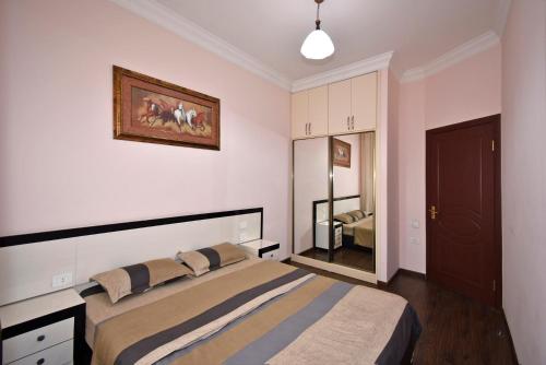 a bedroom with a bed in a room at Buzand street 1 bedroom Newly Renovated apartment near Republic Square BU777 in Yerevan